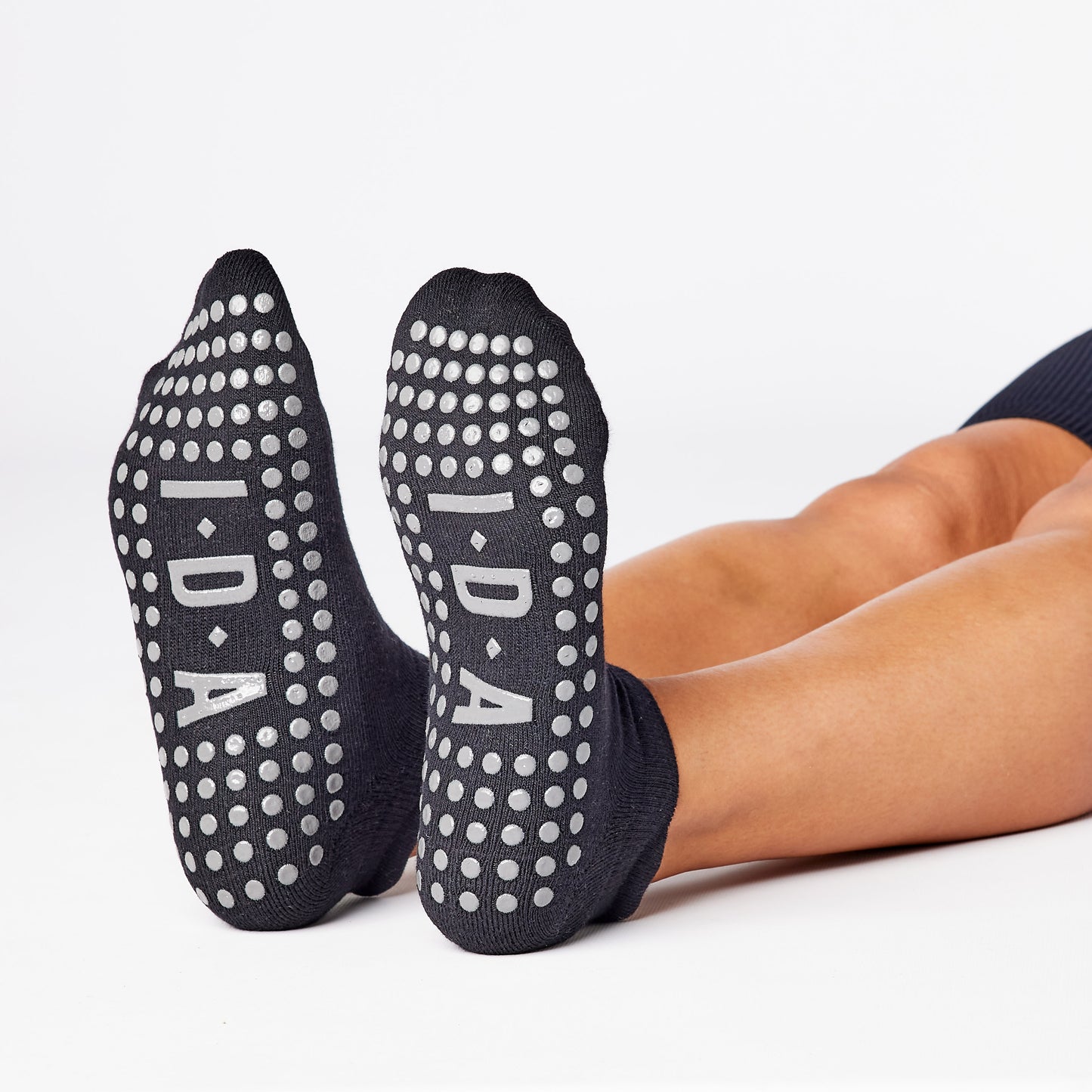 Black ankle grip sock for yoga