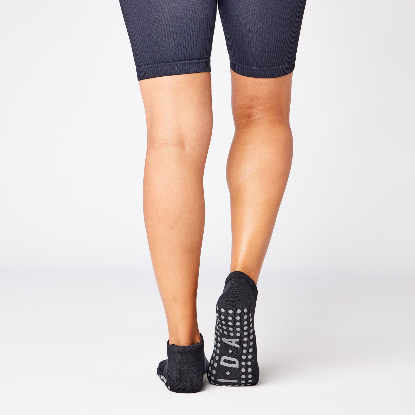 Black ankle grip sock for yoga