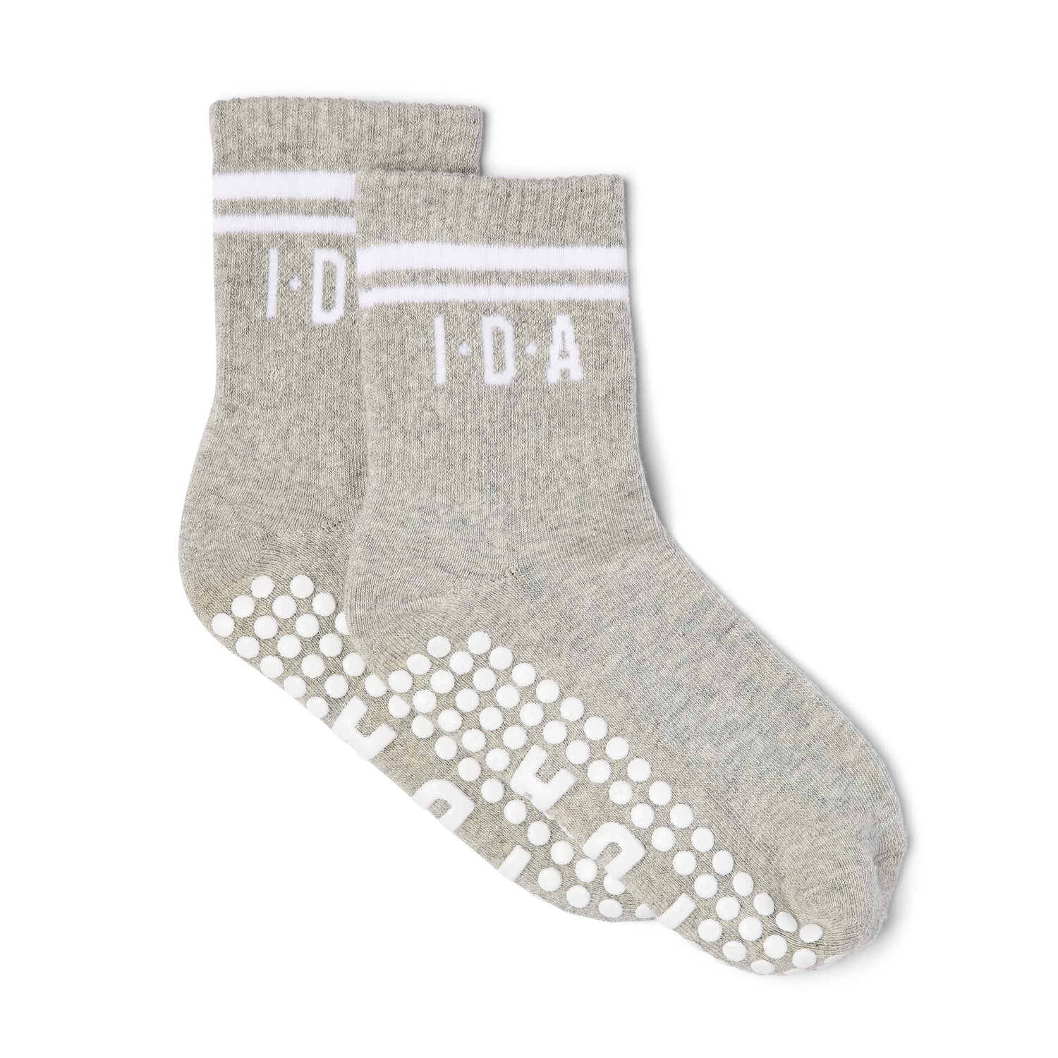 Pair of grey socks with white grip sole pattern on a white background