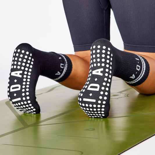 Grip socks being worn in a yoga class