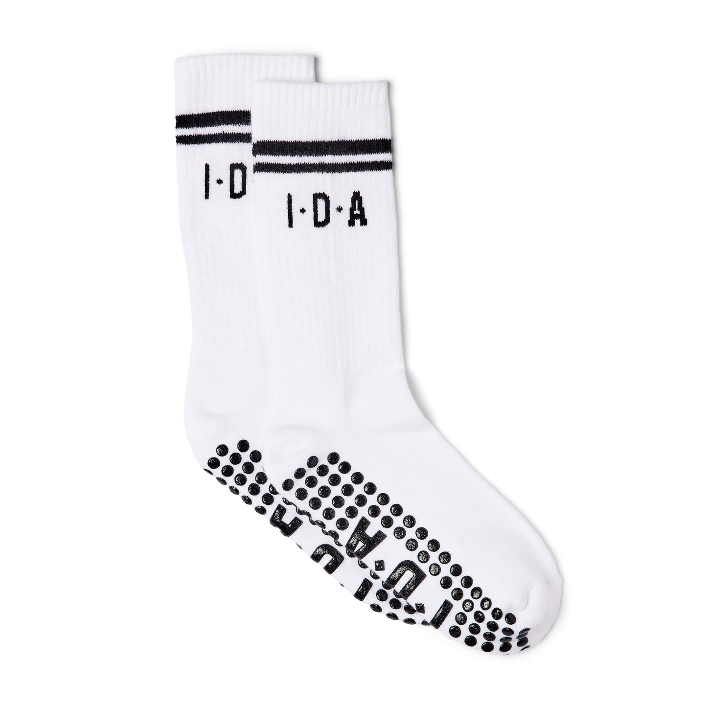 White socks with black grip non-slip sole on a white background